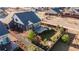 Private fenced backyard with a well-kept lawn, a stone patio, and thoughtfully designed landscaping at 21701 E 50Th Dr, Aurora, CO 80019