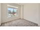 Carpeted room with large window that lets in natural light and a great neighborhood view at 21701 E 50Th Dr, Aurora, CO 80019