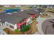 Community clubhouse with modern architectural design, landscaping, and convenient parking at 21701 E 50Th Dr, Aurora, CO 80019