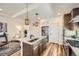 Modern kitchen with stainless steel appliances, a spacious island, and sleek cabinetry in an open layout at 21701 E 50Th Dr, Aurora, CO 80019