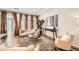 Bright living room with neutral decor, a textured rug, and ample seating at 21701 E 50Th Dr, Aurora, CO 80019
