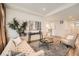 Cozy living room with stylish furniture, soft lighting, and a neutral color palette that offers a comfortable atmosphere at 21701 E 50Th Dr, Aurora, CO 80019