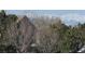 Street view with house partially visible and the Rocky Mountains in the background at 21701 E 50Th Dr, Aurora, CO 80019