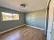 Well-lit bedroom with vinyl flooring, a window, and closet at 8127 Lafayette St, Denver, CO 80229