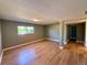 This spacious bedroom has laminate flooring and a large window that allows natural light to illuminate the room at 8127 Lafayette St, Denver, CO 80229