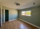 Spacious room featuring contemporary lighting and a bright window with backyard views at 8127 Lafayette St, Denver, CO 80229