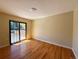 Bedroom featuring hardwood floors, sliding glass door and lots of natural light at 8127 Lafayette St, Denver, CO 80229