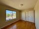 Bright bedroom with hardwood floors, ample closet space, and a large window at 8127 Lafayette St, Denver, CO 80229