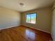 Inviting bedroom featuring hardwood floors and a window for natural light at 8127 Lafayette St, Denver, CO 80229