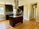 Kitchen featuring granite counters, modern appliances, and hardwood floors at 8127 Lafayette St, Denver, CO 80229