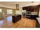Open kitchen with a granite island, stainless steel appliances and lots of cabinet space at 8127 Lafayette St, Denver, CO 80229