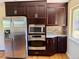 Kitchen featuring stainless steel appliances, granite counters and backsplash at 8127 Lafayette St, Denver, CO 80229