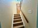Entry staircase with natural light and decorative glass door at 8127 Lafayette St, Denver, CO 80229