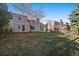 Backyard view shows a concrete patio and an adjacent deck with stairs at 6459 E Hinsdale Ave, Centennial, CO 80112