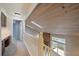 Light-filled hallway with skylights and a view of the staircase and living area below at 6459 E Hinsdale Ave, Centennial, CO 80112