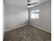 Spacious bedroom with neutral carpeting and ceiling fan at 4758 Kittredge St # 2, Denver, CO 80239
