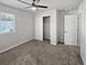 Bright bedroom with ceiling fan and walk-in closet at 4758 Kittredge St # 2, Denver, CO 80239