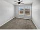 Spacious bedroom with neutral carpeting and ceiling fan at 4758 Kittredge St # 2, Denver, CO 80239
