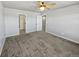 Large bedroom with plush carpeting and ensuite bathroom access at 4758 Kittredge St # 2, Denver, CO 80239