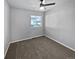 Spacious bedroom with neutral carpeting and ceiling fan at 4758 Kittredge St # 2, Denver, CO 80239