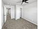 Bright bedroom with ceiling fan and walk-in closet at 4758 Kittredge St # 2, Denver, CO 80239