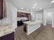 Spacious kitchen featuring granite countertops and dark wood cabinets at 4758 Kittredge St # 2, Denver, CO 80239