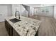 Modern kitchen with granite countertops and stainless steel appliances at 4758 Kittredge St # 2, Denver, CO 80239