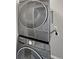 Stackable washer and dryer in a dedicated laundry room at 4758 Kittredge St # 2, Denver, CO 80239