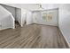 Open living room with wood-look floors and neutral color palette at 4758 Kittredge St # 2, Denver, CO 80239