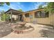 Backyard view featuring a covered patio and charming fountain at 11936 E Oregon Cir, Aurora, CO 80012