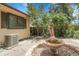 Relaxing backyard featuring a charming fountain and patio area at 11936 E Oregon Cir, Aurora, CO 80012