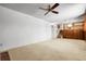 Finished basement with carpet and a staircase leading to the upper level at 11936 E Oregon Cir, Aurora, CO 80012