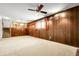 Finished basement features wood paneling, and a staircase leading to the upper level at 11936 E Oregon Cir, Aurora, CO 80012