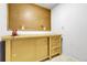 Unfinished basement with pegboard and workbench, perfect for DIY projects and storage at 11936 E Oregon Cir, Aurora, CO 80012