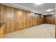 Finished basement with carpet and wood paneled walls at 11936 E Oregon Cir, Aurora, CO 80012