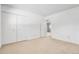 Spacious bedroom featuring neutral carpet, closet, and easy access to other rooms at 11936 E Oregon Cir, Aurora, CO 80012