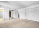 Large bedroom with neutral carpet, closet and easy access to bathroom and other rooms at 11936 E Oregon Cir, Aurora, CO 80012