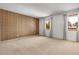 Large bedroom with neutral carpet, stylish wallpaper, and lots of bright, natural light at 11936 E Oregon Cir, Aurora, CO 80012
