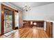Dining area with hardwood floors, chandelier lighting, and access to the outdoor patio at 11936 E Oregon Cir, Aurora, CO 80012