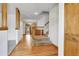 Inviting entryway features hardwood flooring, a carpeted staircase, and a light-filled atmosphere at 11936 E Oregon Cir, Aurora, CO 80012
