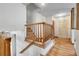 Bright entryway with hardwood floors, decorative molding, and a staircase leading to the upper level at 11936 E Oregon Cir, Aurora, CO 80012