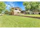 Spacious lawn showcases the home's exterior and well-kept landscaping at 11936 E Oregon Cir, Aurora, CO 80012