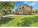Charming two-story home with a well-manicured lawn and wrought iron fence at 11936 E Oregon Cir, Aurora, CO 80012