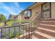 Attractive home with a brick exterior, landscaped yard, and inviting front entry stairs at 11936 E Oregon Cir, Aurora, CO 80012