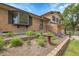 Charming two-story home with a brick exterior and landscaped front yard with mature foliage at 11936 E Oregon Cir, Aurora, CO 80012