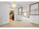 Open-concept space with modern lighting fixtures and views into the adjacent kitchen at 11936 E Oregon Cir, Aurora, CO 80012