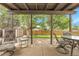Covered patio with outdoor seating, perfect for enjoying the serene backyard and sunshine at 11936 E Oregon Cir, Aurora, CO 80012