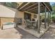 A covered patio features an outdoor dining area, ideal for entertaining at 11936 E Oregon Cir, Aurora, CO 80012