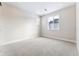 Simple bedroom with carpeted floors and a window offering natural light at 5723 Farrier Pt, Castle Rock, CO 80104