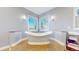 Bathroom featuring a soaking tub with a view at 10667 E Goose Haven Dr, Lafayette, CO 80026